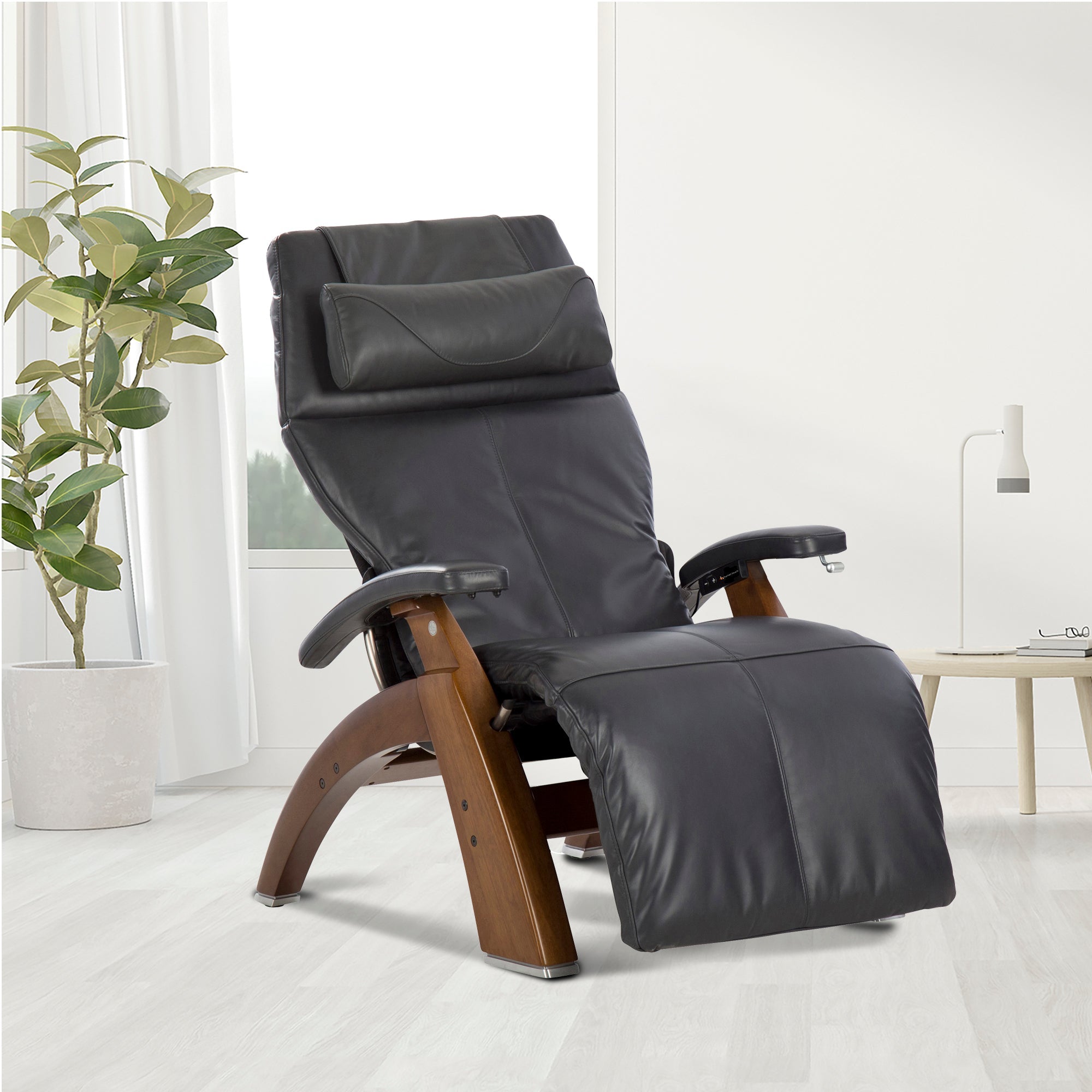 Perfect Chair PC-420 Classic Manual Plus recliner in black leather with wooden base, shown in modern living room setting