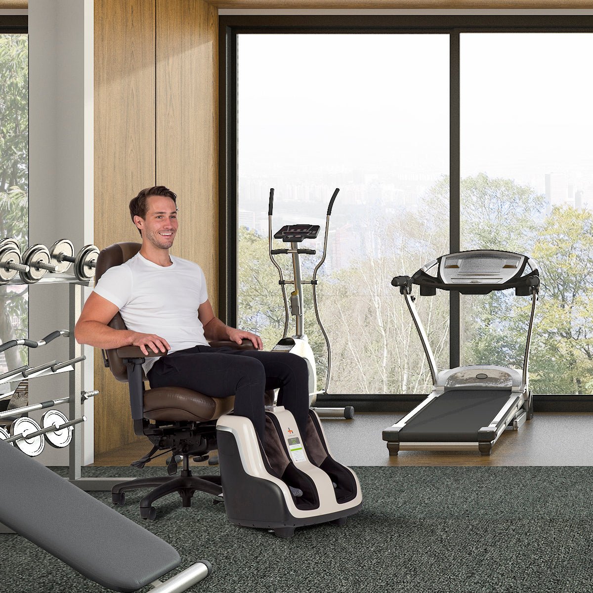 Reflex SOL foot and calf massager in home gym setting with exercise equipment and panoramic windows