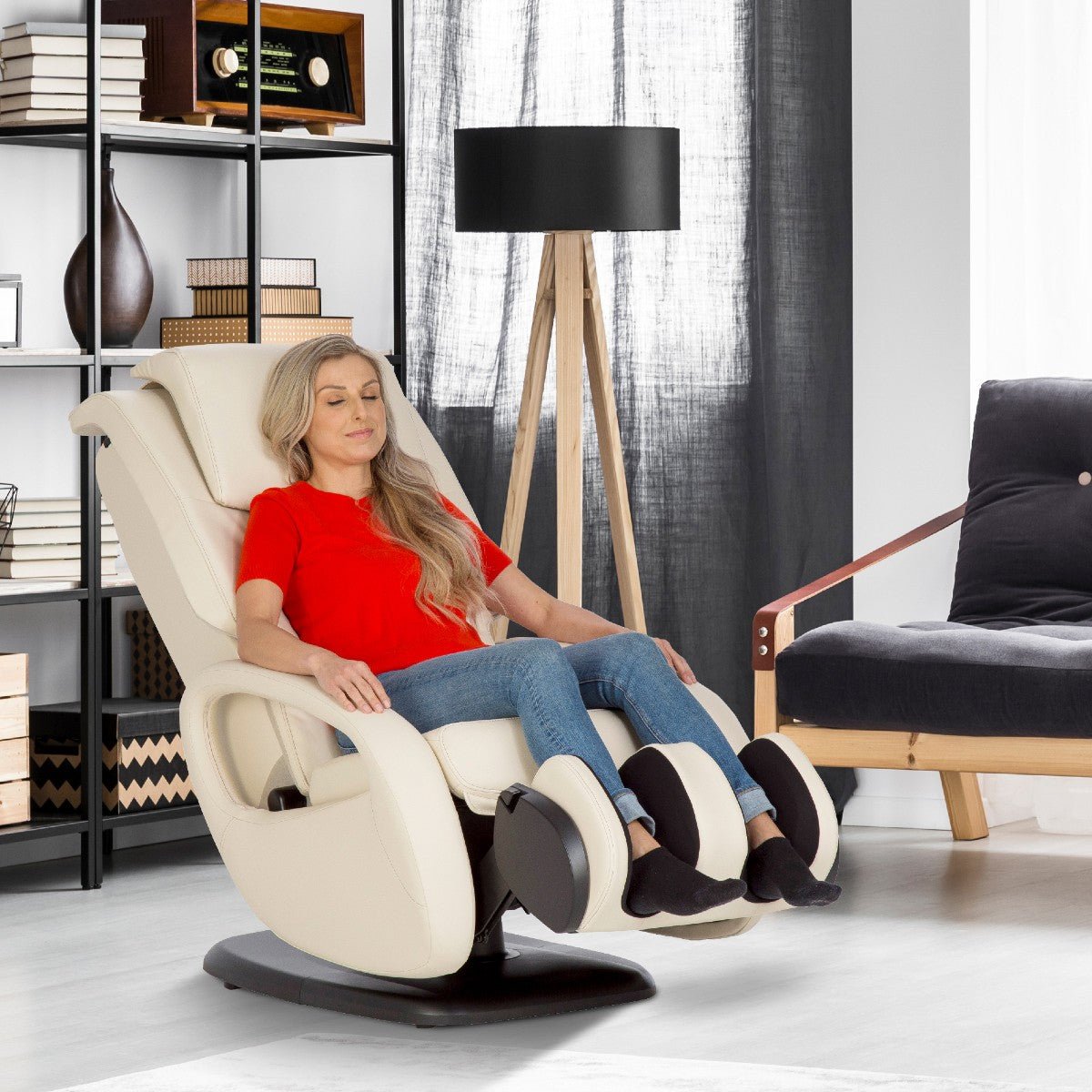 WholeBody 5.1 massage chair in cream color shown in modern living room with person relaxing in reclined position