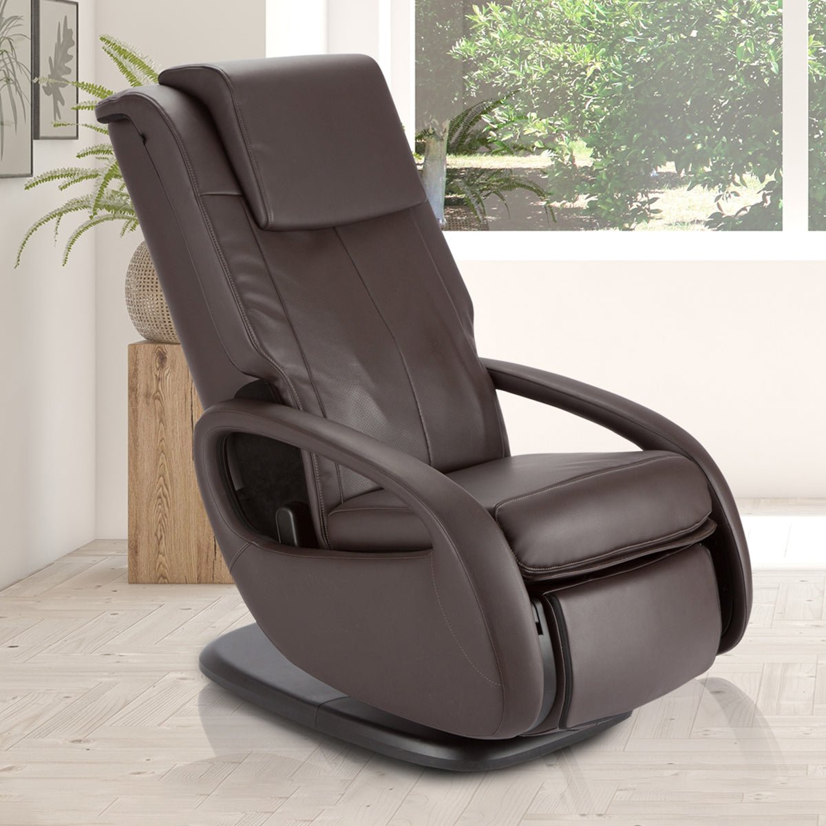 WholeBody 7.1 massage chair in brown leather, positioned in bright modern room with natural lighting and plants