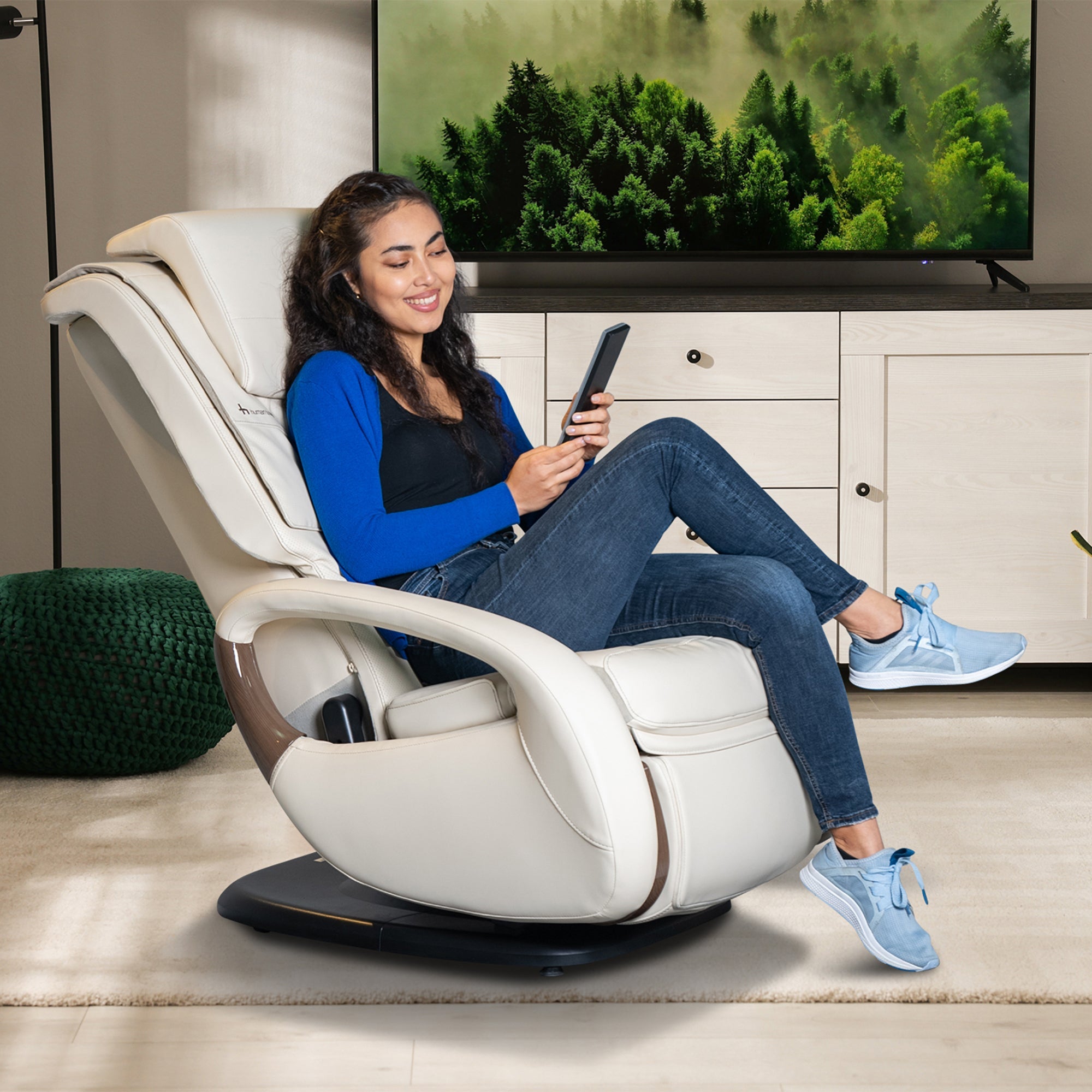 WholeBody 8.0 Massage Chair shown in cream color, positioned in modern living room with relaxed person enjoying comfort